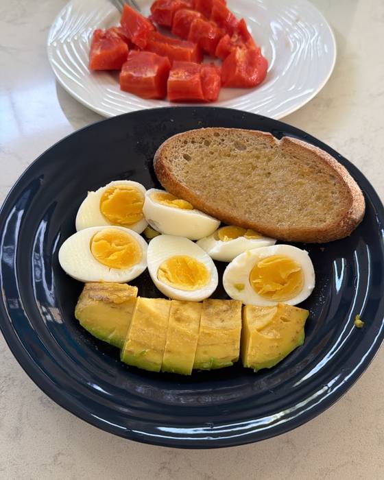 Boiled eggs, avocado, tomatoes and wholemeal toast.
