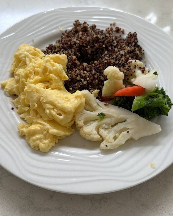 Scrambled eggs with quinoa, cauliflower and mixed vegetables.