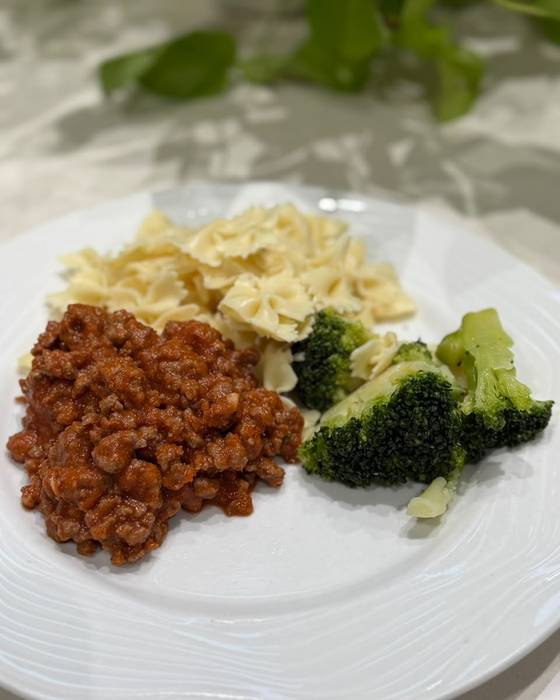 Mince in tomato sauce with pasta and broccoli.